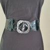 Black faux leather belt with buckle. Elastic at back. Black