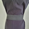 Black faux leather belt with buckle. Elastic at back. Black