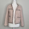 Elegant tweed-style jacket in blush pink with subtle Pink