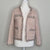 Elegant tweed-style jacket in blush pink with subtle Pink