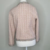 Elegant tweed-style jacket in blush pink with subtle Pink