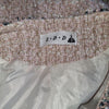 Elegant tweed-style jacket in blush pink with subtle Pink