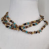 Brown and tan beaded necklace with gold accents, jewellery