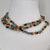 Brown and tan beaded necklace with gold accents, jewellery