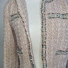 Elegant tweed-style jacket in blush pink with subtle Pink