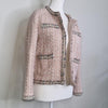 Elegant tweed-style jacket in blush pink with subtle Pink