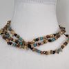 Brown and tan beaded necklace with gold accents, jewellery