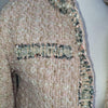 Elegant tweed-style jacket in blush pink with subtle Pink
