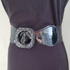 Black faux leather belt with buckle. Elastic at back. Black